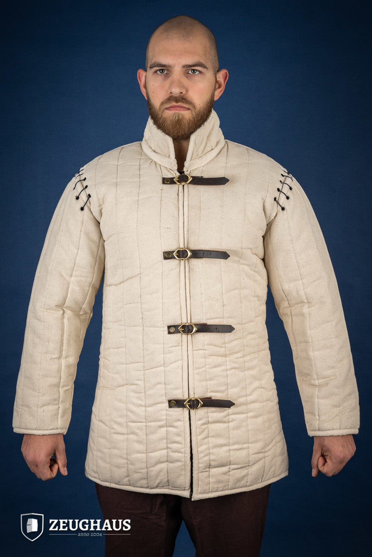 Gambeson with removable laced arms in natural color, featuring buckles for easy wear and open underarm design for mobility.