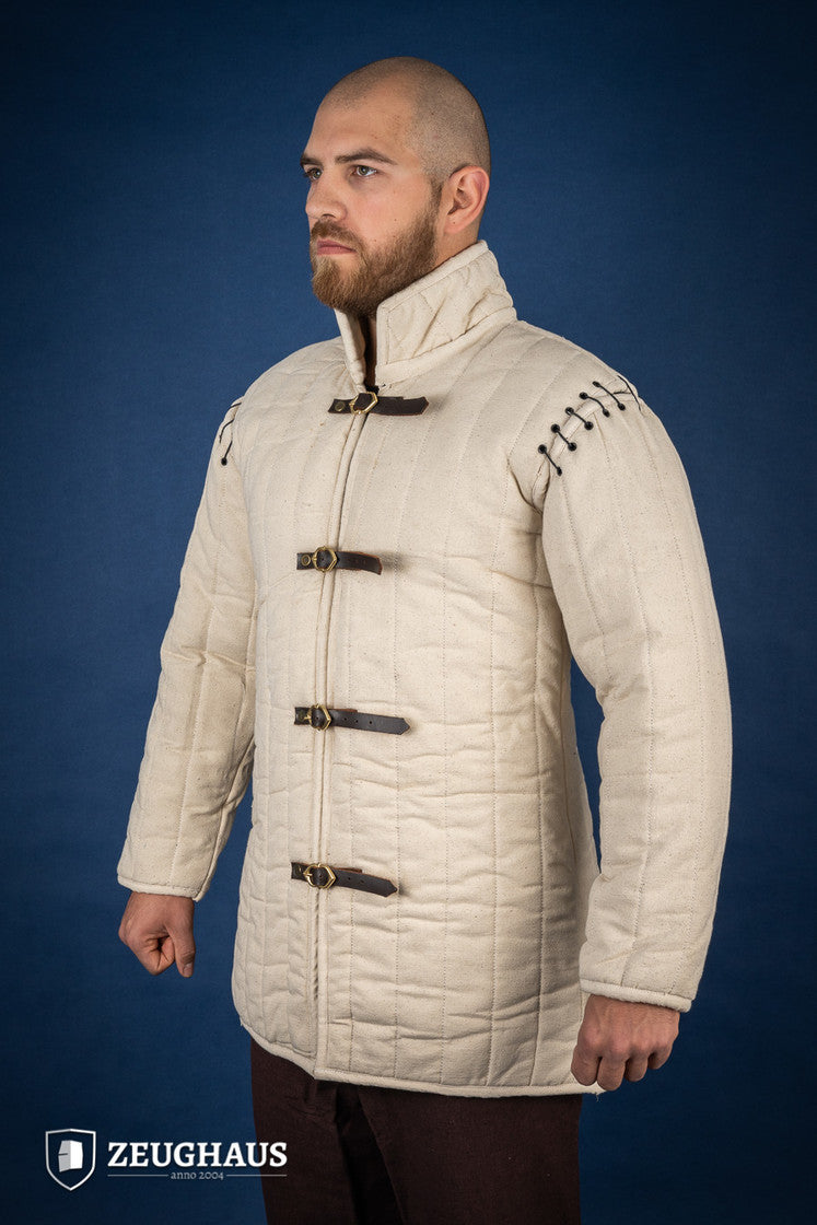 Gambeson with removable laced arms in natural color, featuring buckles for easy wear and open underarm design for mobility.