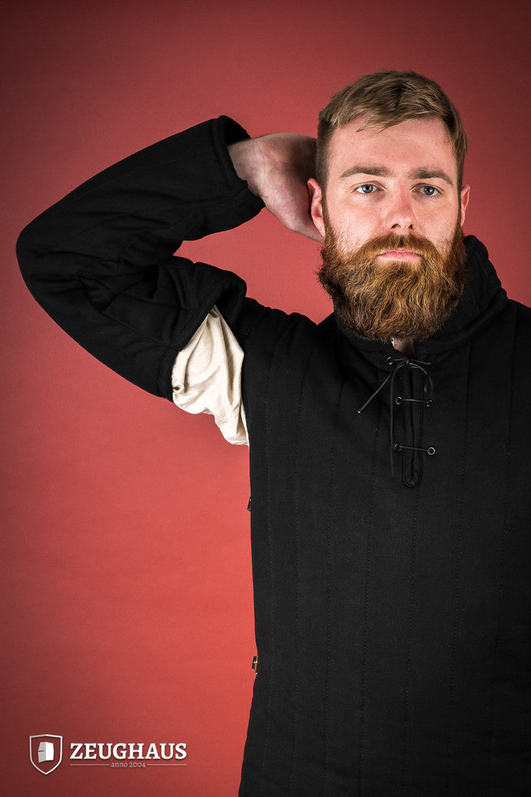Black gambeson featuring side buckles and modified neckline, inspired by medieval illustrations.