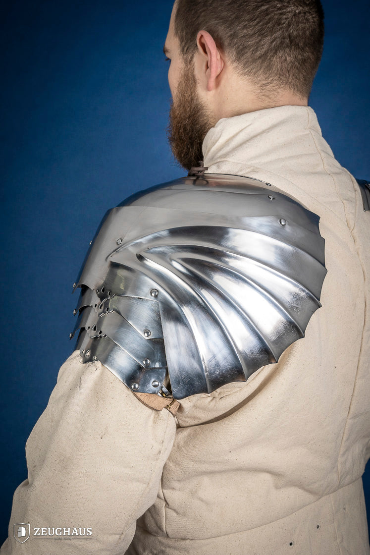 Polished German Pauldrons made of 1.2 mm steel, featuring a layered design and elegant folded style, perfect for historical reenactments.