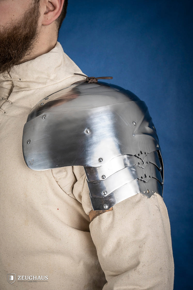 Polished German Pauldrons made of 1.2 mm steel, featuring a layered design and elegant folded style, perfect for historical reenactments.