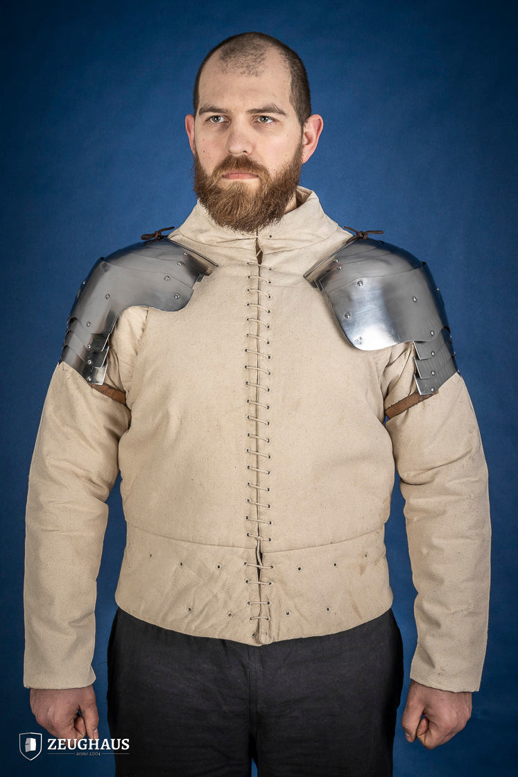 Polished German Pauldrons made of 1.2 mm steel, featuring a layered design and elegant folded style, perfect for historical reenactments.