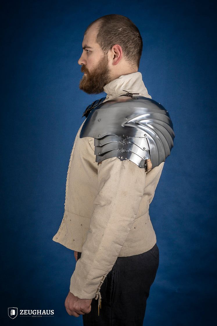 Polished German Pauldrons made of 1.2 mm steel, featuring a layered design and elegant folded style, perfect for historical reenactments.