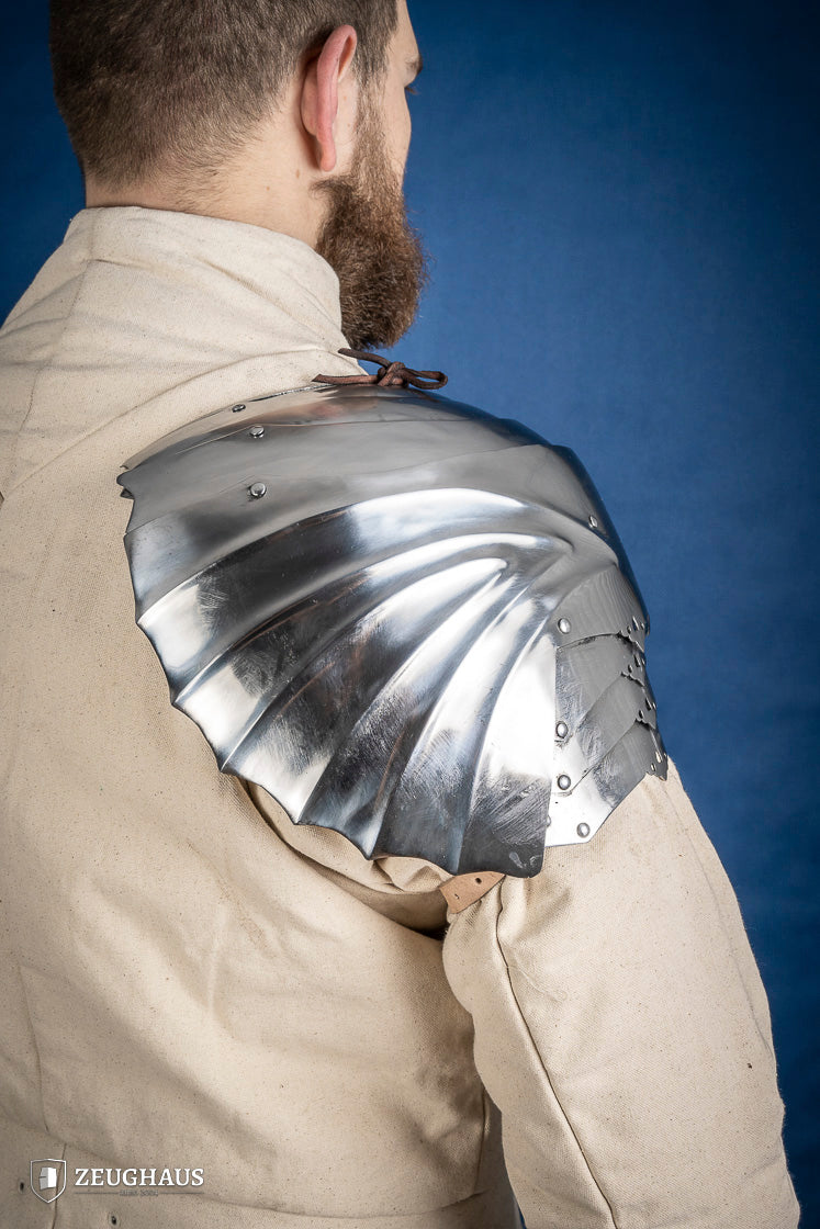 Polished German Pauldrons made of 1.2 mm steel, featuring a layered design and elegant folded style, perfect for historical reenactments.