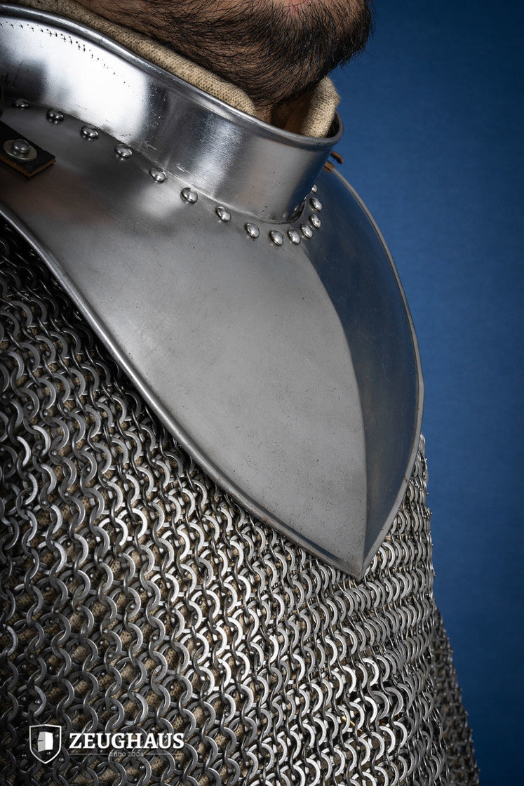 Polished gorget with stand-up collar, featuring crimped edges and leather straps, designed for neck protection and flexibility.
