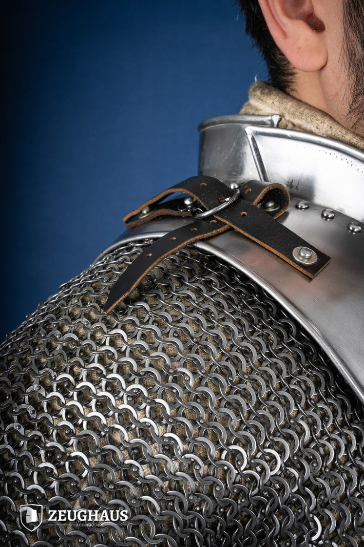 Polished gorget with stand-up collar, featuring crimped edges and leather straps, designed for neck protection and flexibility.