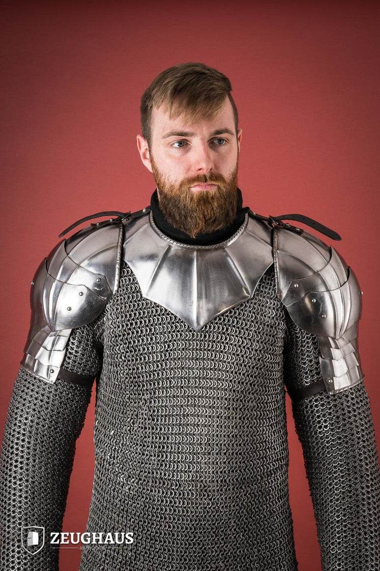 Polished Gothic Pauldrons with fluted design, showcasing flexibility and craftsmanship, ideal for medieval reenactments.