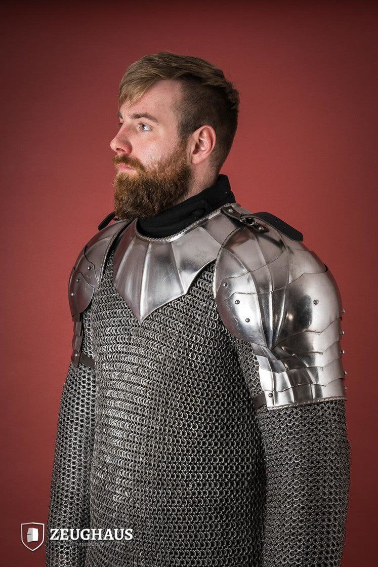 Polished Gothic Pauldrons with fluted design, showcasing flexibility and craftsmanship, ideal for medieval reenactments.