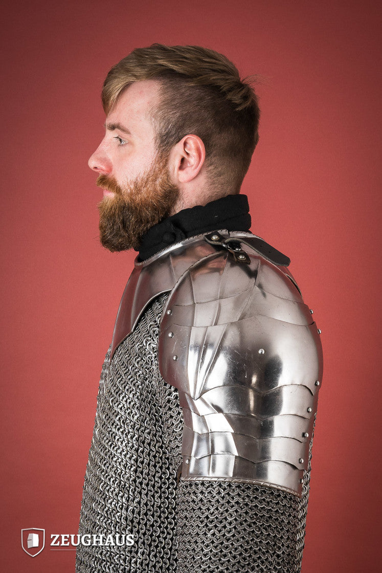 Polished Gothic Pauldrons with fluted design, showcasing flexibility and craftsmanship, ideal for medieval reenactments.