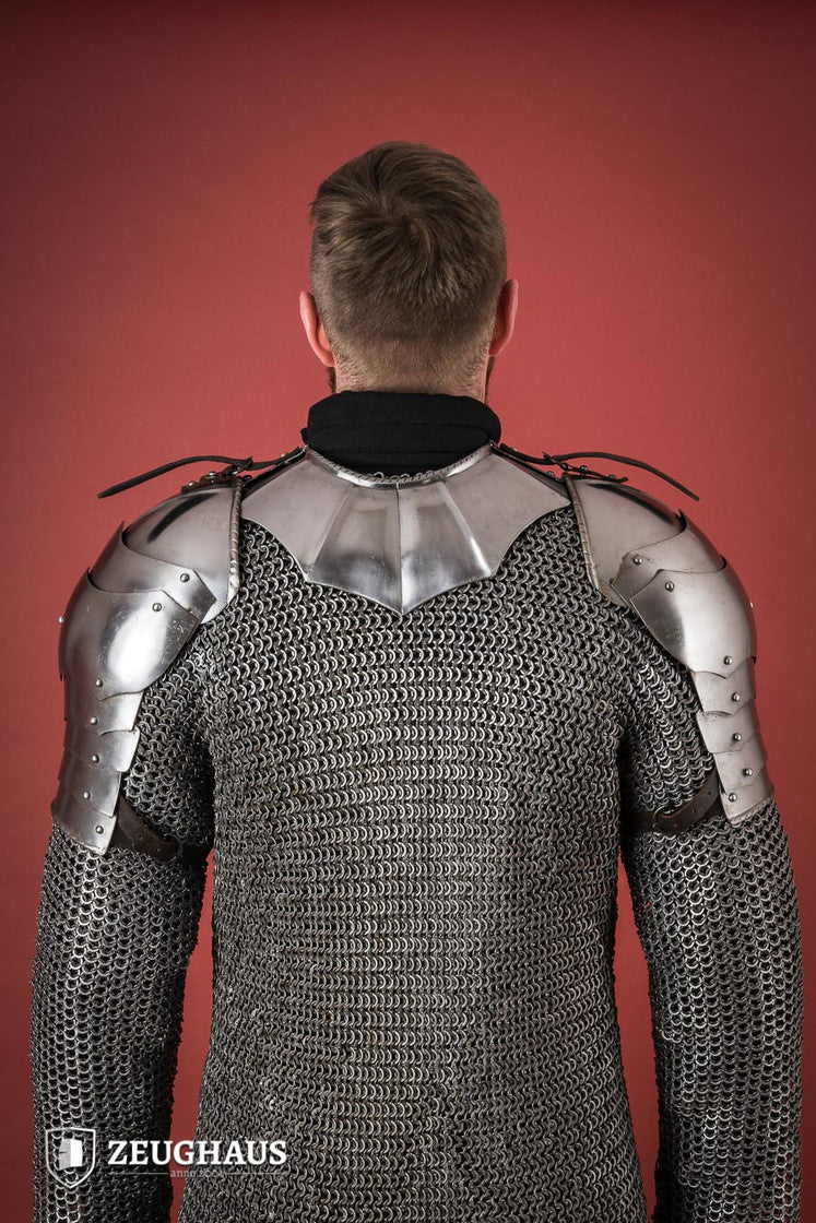Polished Gothic Pauldrons with fluted design, showcasing flexibility and craftsmanship, ideal for medieval reenactments.
