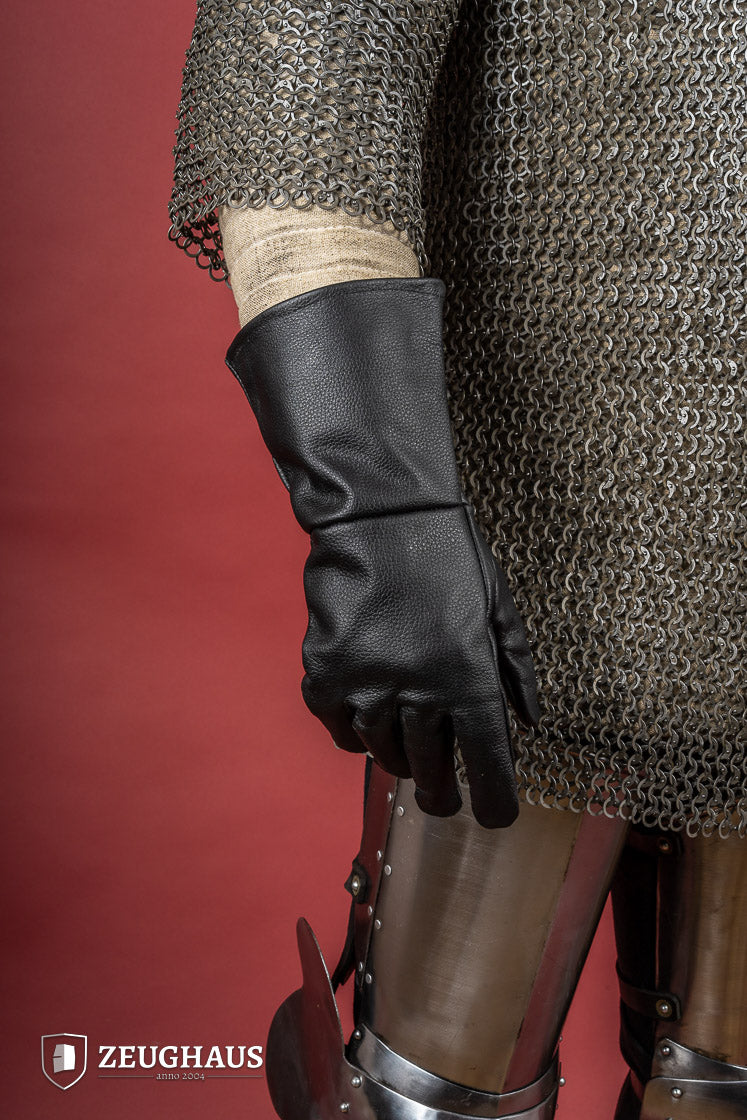 A pair of black historical leather gloves made from top-grade cowhide, showcasing unique textures and craftsmanship.