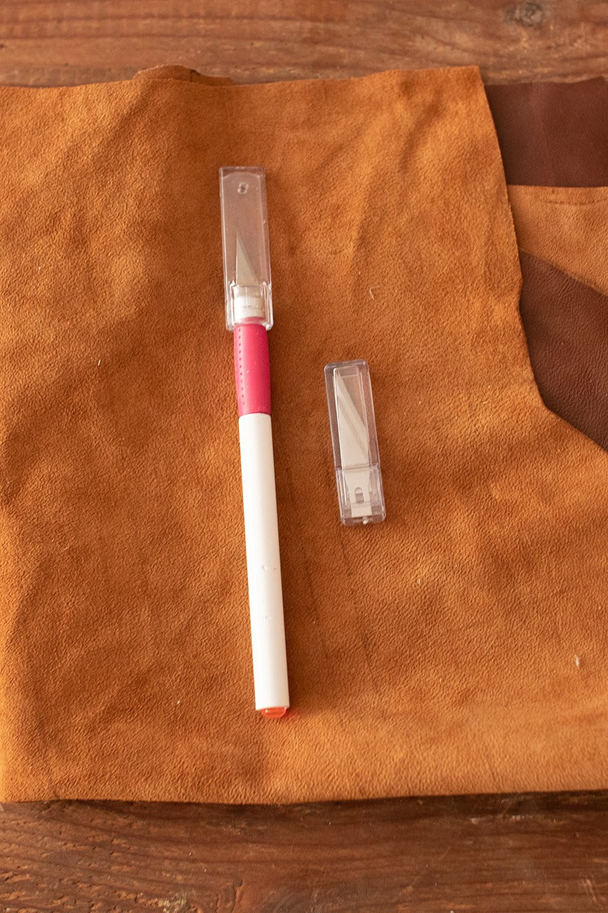 A sleek aluminum hobby knife designed for precision cutting, ideal for leather and other materials.