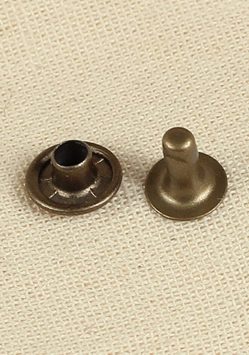 Hollow Rivet Ø9,0 x 7,8 mm made of iron and brass, showcasing its antique finish and hollow design for leather crafting.