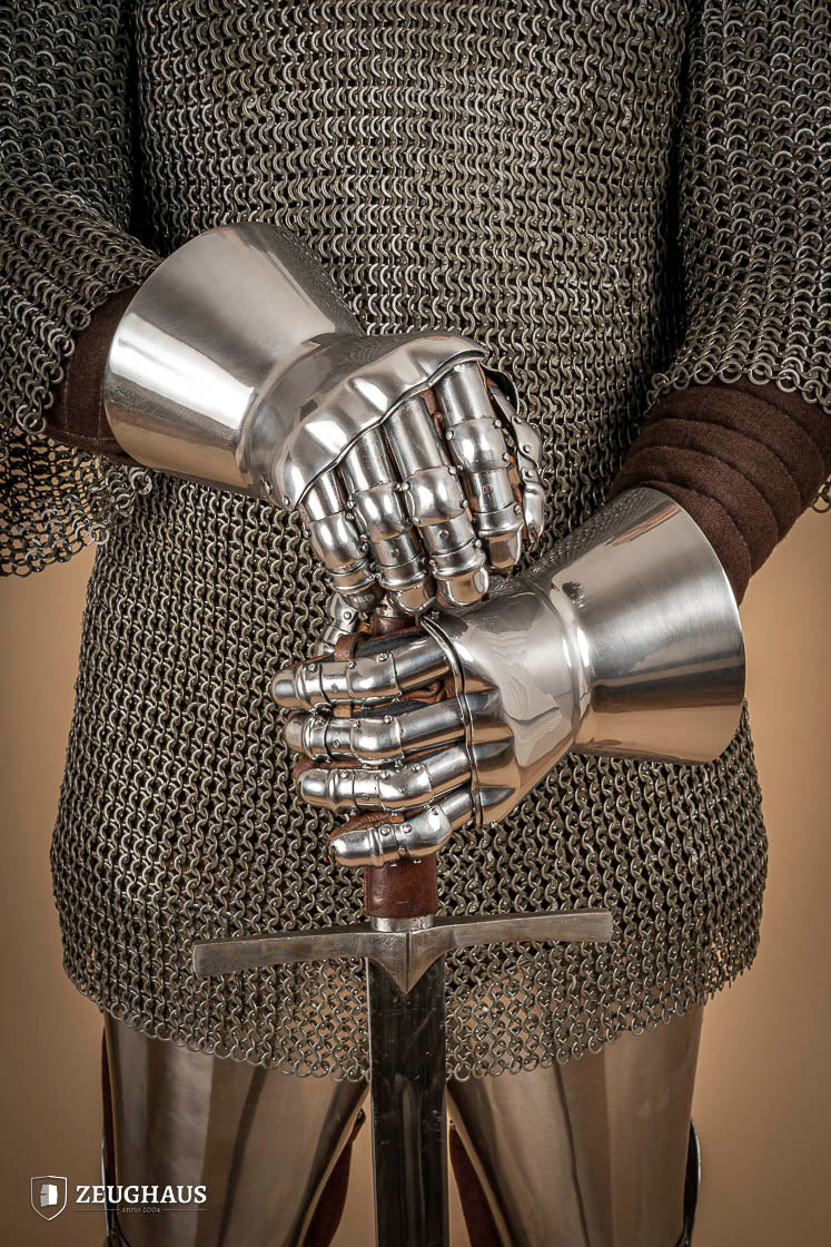 A pair of Hourglass Gauntlets made from 1.6mm steel, featuring a dramatic cuff design and leather gloves for comfort.