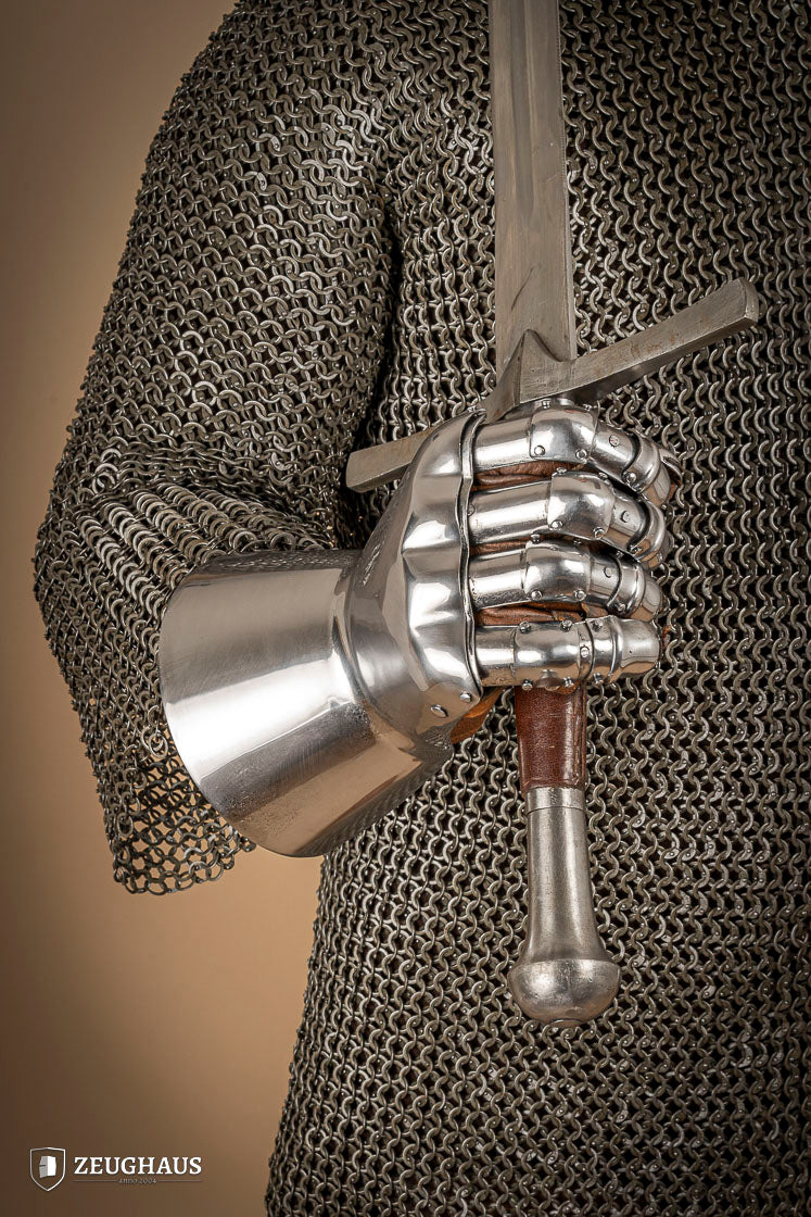 A pair of Hourglass Gauntlets made from 1.6mm steel, featuring a dramatic cuff design and leather gloves for comfort.