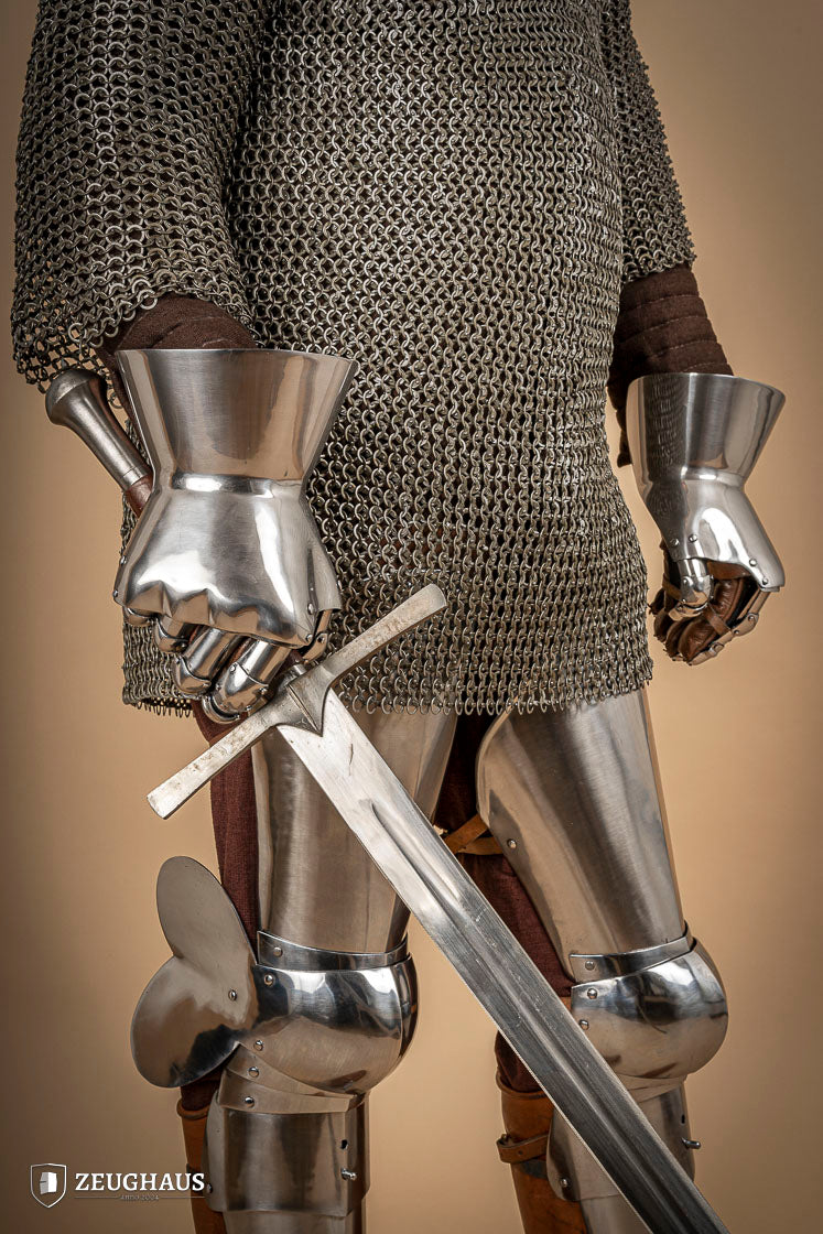 A pair of Hourglass Gauntlets made from 1.6mm steel, featuring a dramatic cuff design and leather gloves for comfort.