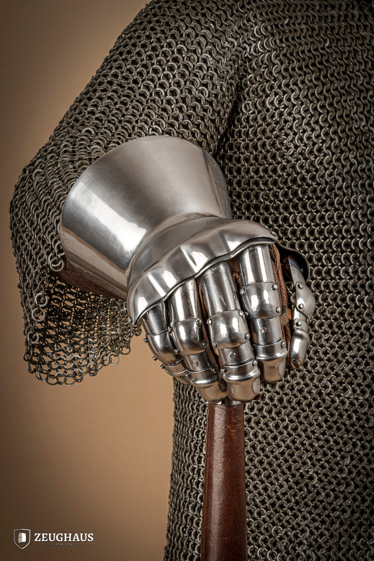 A pair of Hourglass Gauntlets made from 1.6mm steel, featuring a dramatic cuff design and leather gloves for comfort.
