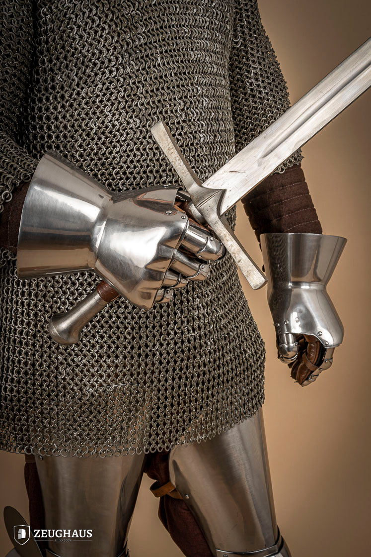 A pair of Hourglass Gauntlets made from 1.6mm steel, featuring a dramatic cuff design and leather gloves for comfort.