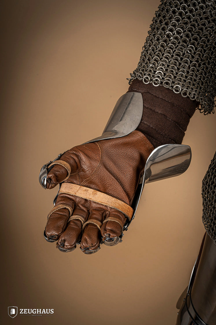 A pair of Hourglass Gauntlets made from 1.6mm steel, featuring a dramatic cuff design and leather gloves for comfort.