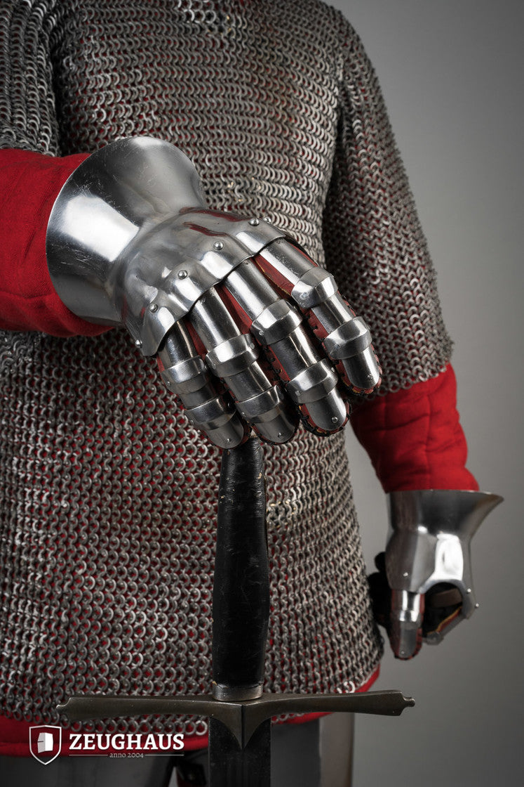 Hourglass Gauntlets made of polished steel, showcasing a wide cuff and historical design, suitable for medieval reenactments.