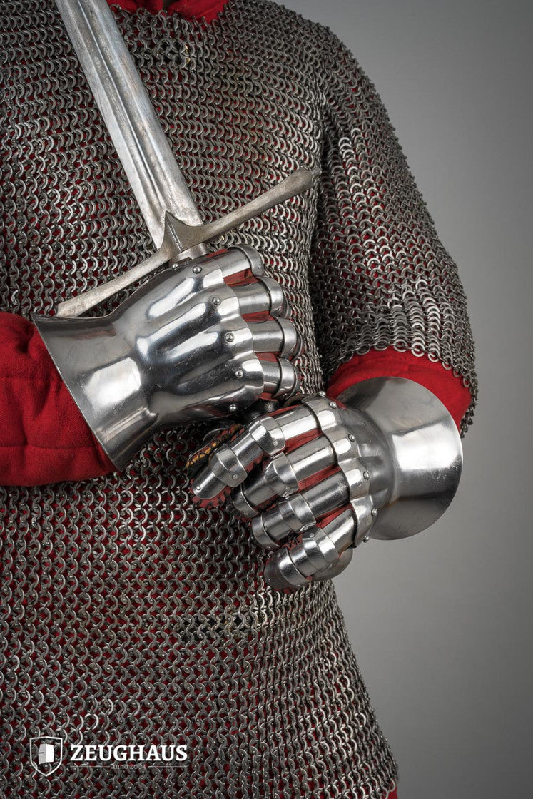 Hourglass Gauntlets made of polished steel, showcasing a wide cuff and historical design, suitable for medieval reenactments.