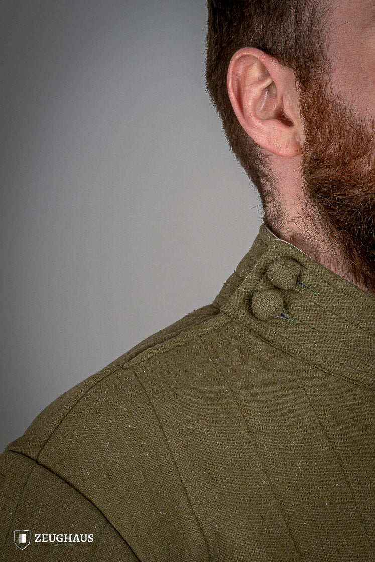 Infantry Gambeson Green featuring neck button closure and slits for mobility, made of 100% cotton with linen pattern.