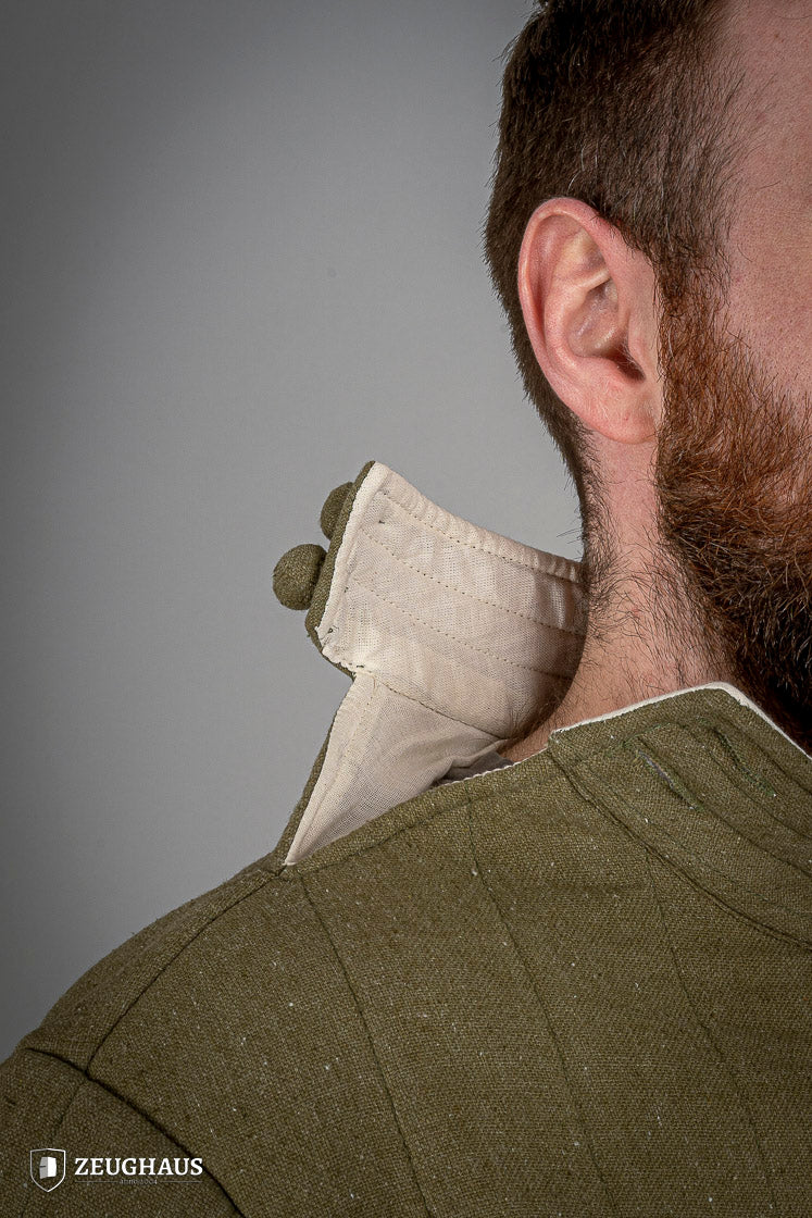 Infantry Gambeson Green featuring neck button closure and slits for mobility, made of 100% cotton with linen pattern.
