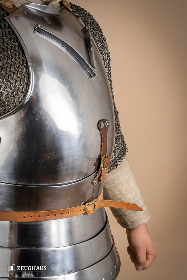Polished Italian cuirass from the 14th century, made of 1.6 mm steel with leather straps, showcasing intricate craftsmanship.