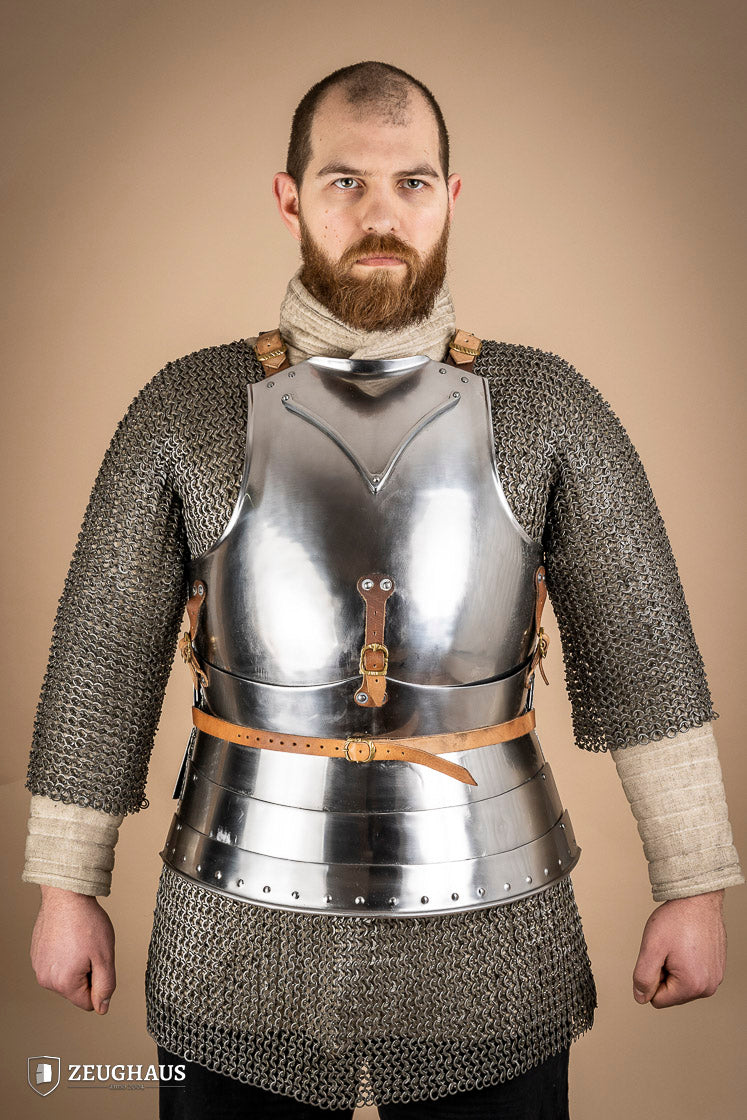 Polished Italian cuirass from the 14th century, made of 1.6 mm steel with leather straps, showcasing intricate craftsmanship.