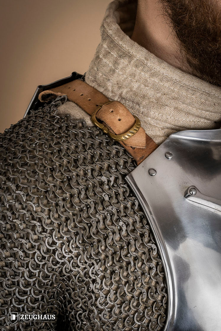 Polished Italian cuirass from the 14th century, made of 1.6 mm steel with leather straps, showcasing intricate craftsmanship.