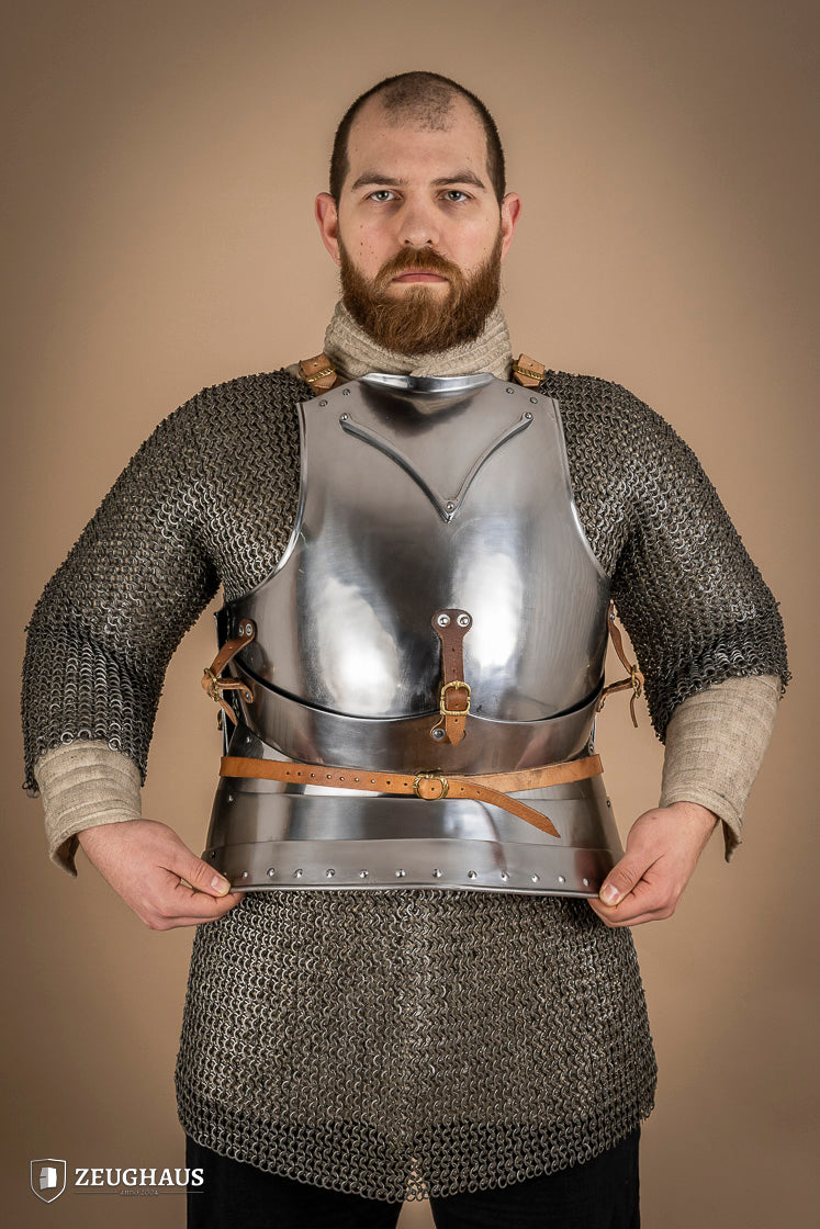 Polished Italian cuirass from the 14th century, made of 1.6 mm steel with leather straps, showcasing intricate craftsmanship.