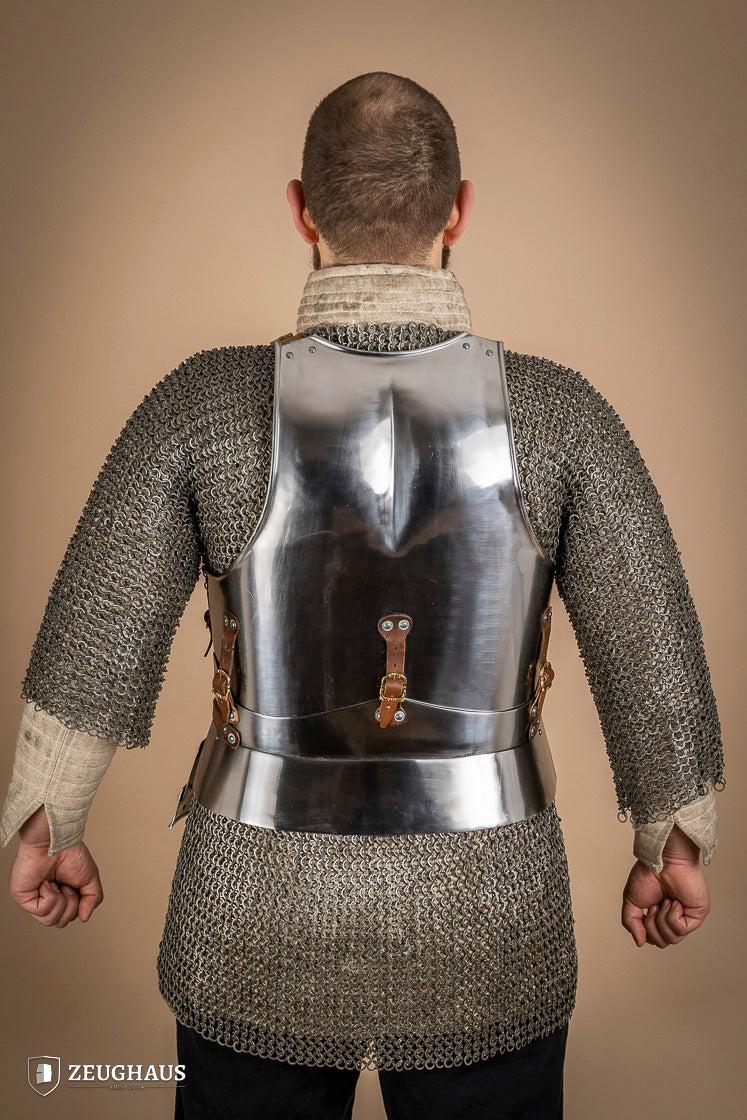 Polished Italian cuirass from the 14th century, made of 1.6 mm steel with leather straps, showcasing intricate craftsmanship.