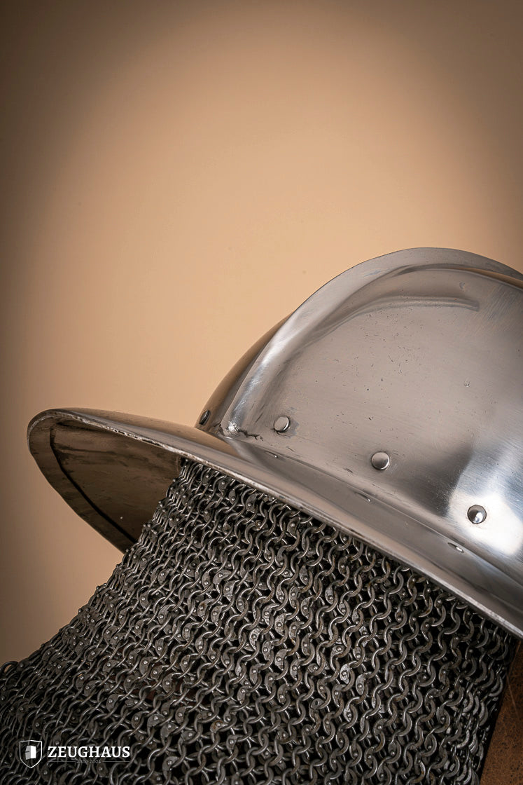 A polished 2 mm steel Kettle Hat Helmet, showcasing its medieval design and leather chin strap, suitable for historical reenactments.