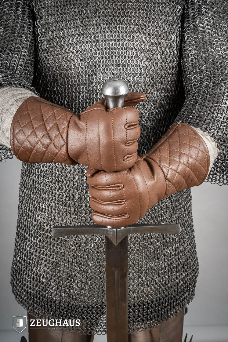 A pair of brown leather gloves designed for martial arts, showcasing natural imperfections and unique color variations.