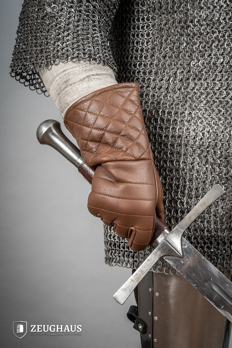 A pair of brown leather gloves designed for martial arts, showcasing natural imperfections and unique color variations.