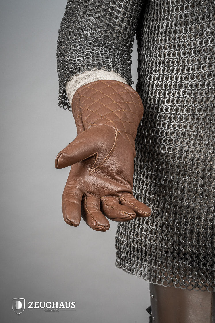 A pair of brown leather gloves designed for martial arts, showcasing natural imperfections and unique color variations.