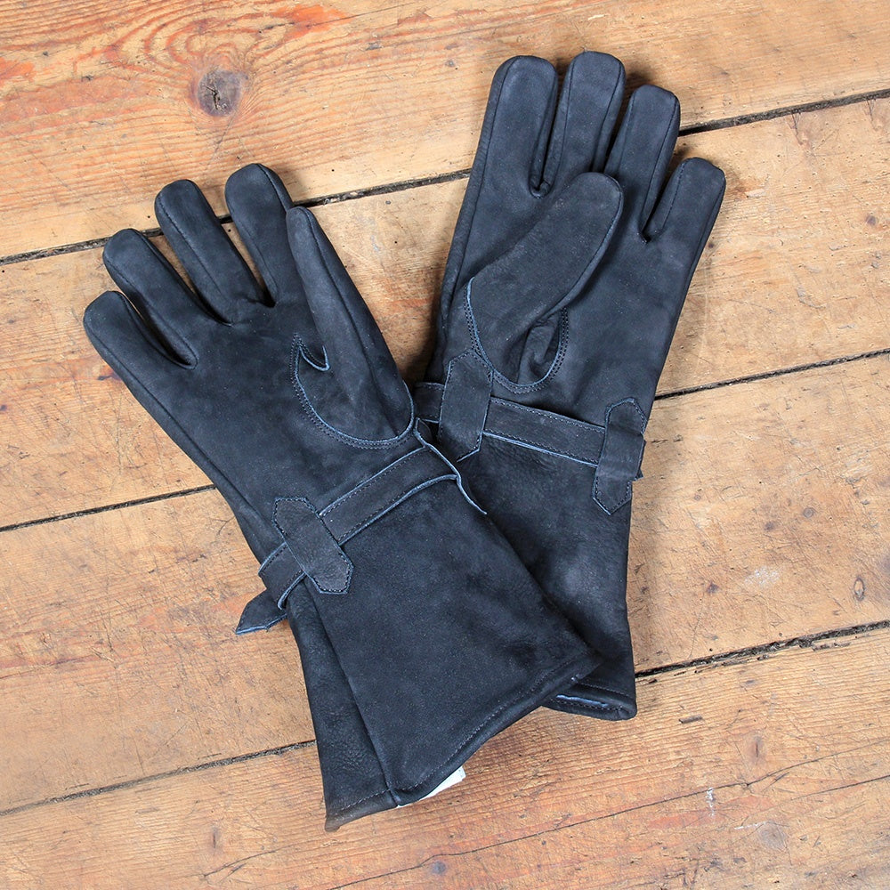 A pair of Ulex Black Leather Gloves made from soft cowhide leather, featuring a stylish brass buckle and a longer cuff for wrist protection.