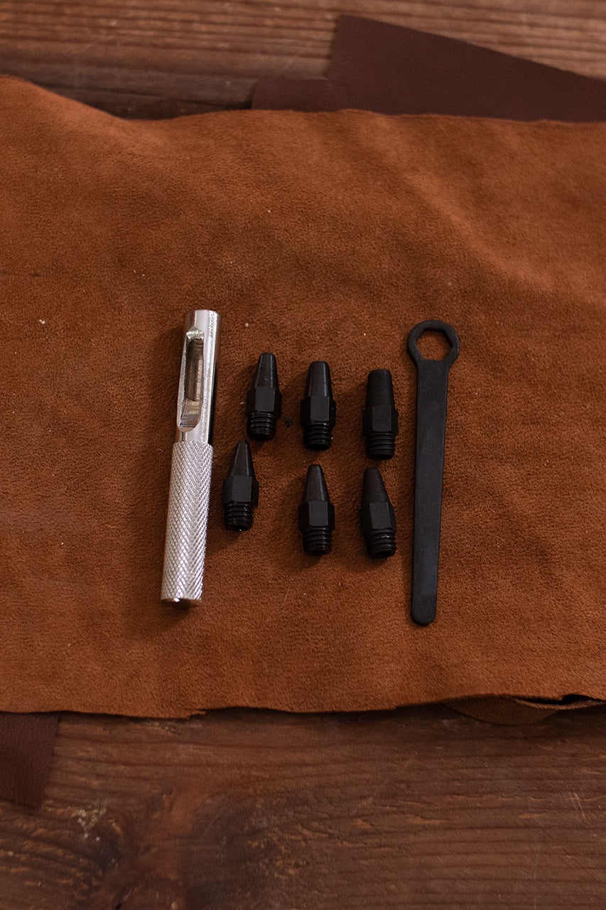 Miniature Leather Punch Set featuring six iron stamps and one handle, ideal for precise leather crafting.