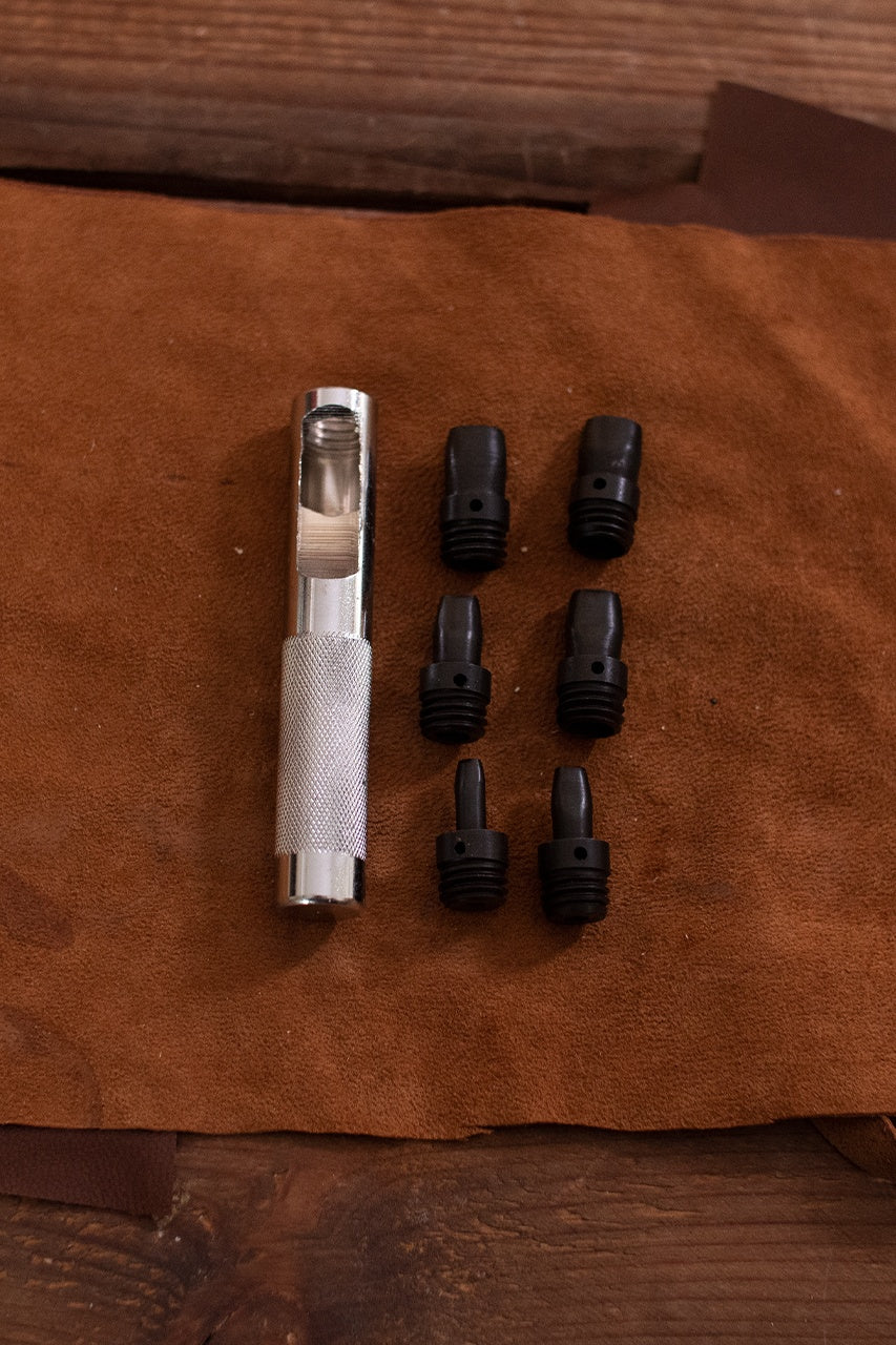 Leather Punch Set oval with six iron stamps and handle, ideal for precise leather crafting.