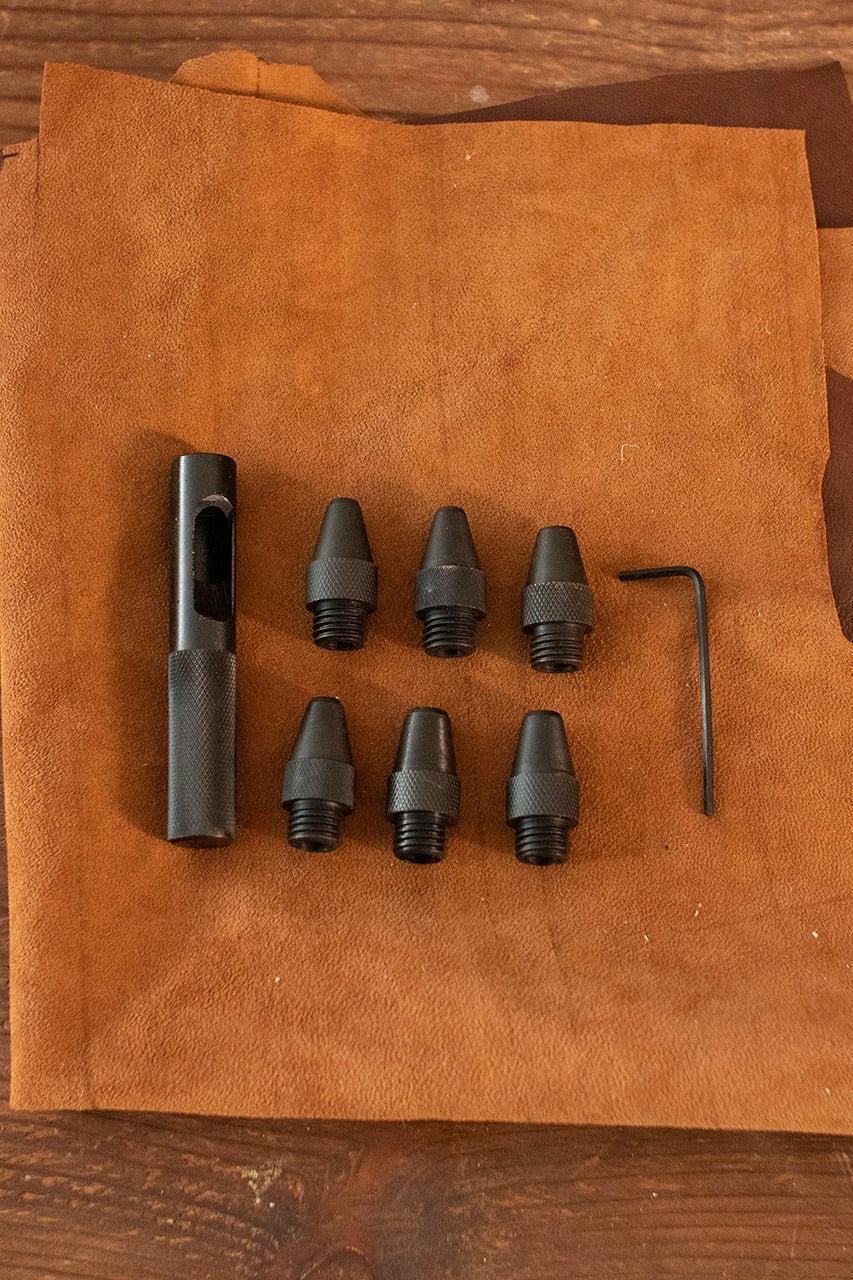 Leather Puncher with six punching sizes and iron handle, ideal for crafting.