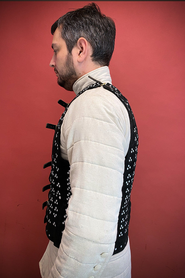 Leeds Brigantine Black armor made of steel and studded suede leather, featuring adjustable leather straps and multiple metal plates for protection and mobility.