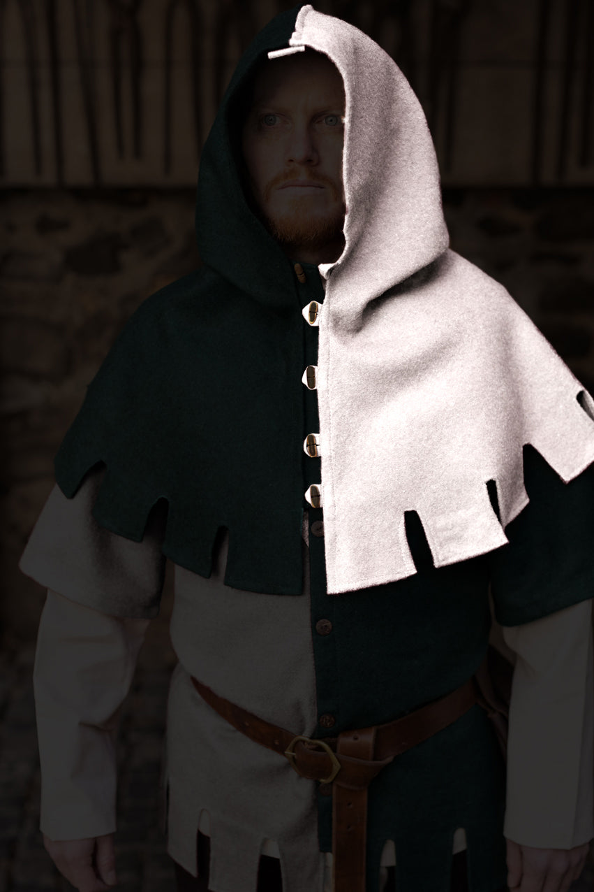 Left Side Cowl Dangereuse Natural, a medieval-inspired hood made of sturdy wool fabric with rustic wooden buttons and elegant crenelated design.
