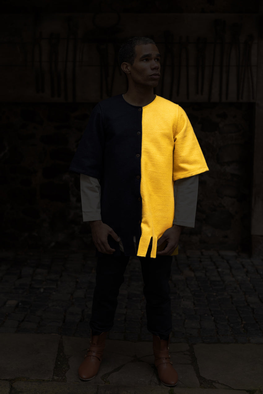 Left Side Surcoat Aleran in vibrant yellow with stylish wooden buttons and wide sleeves, showcasing its unique design and historical significance.