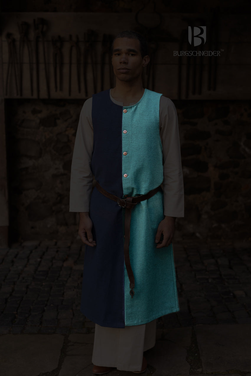 Left Side Tabard Auderic Green made from heavy cotton, featuring stylish wooden buttons and wide armholes for movement.