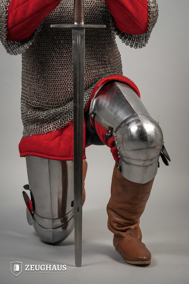 14th Century Leg Armour made of 1.6mm polished steel, featuring open back design and leather straps for secure fit.