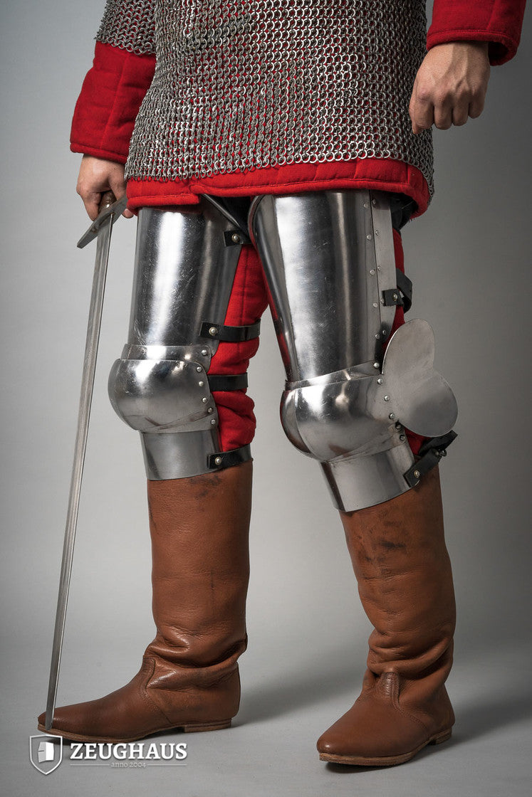 14th Century Leg Armour made of 1.6mm polished steel, featuring open back design and leather straps for secure fit.