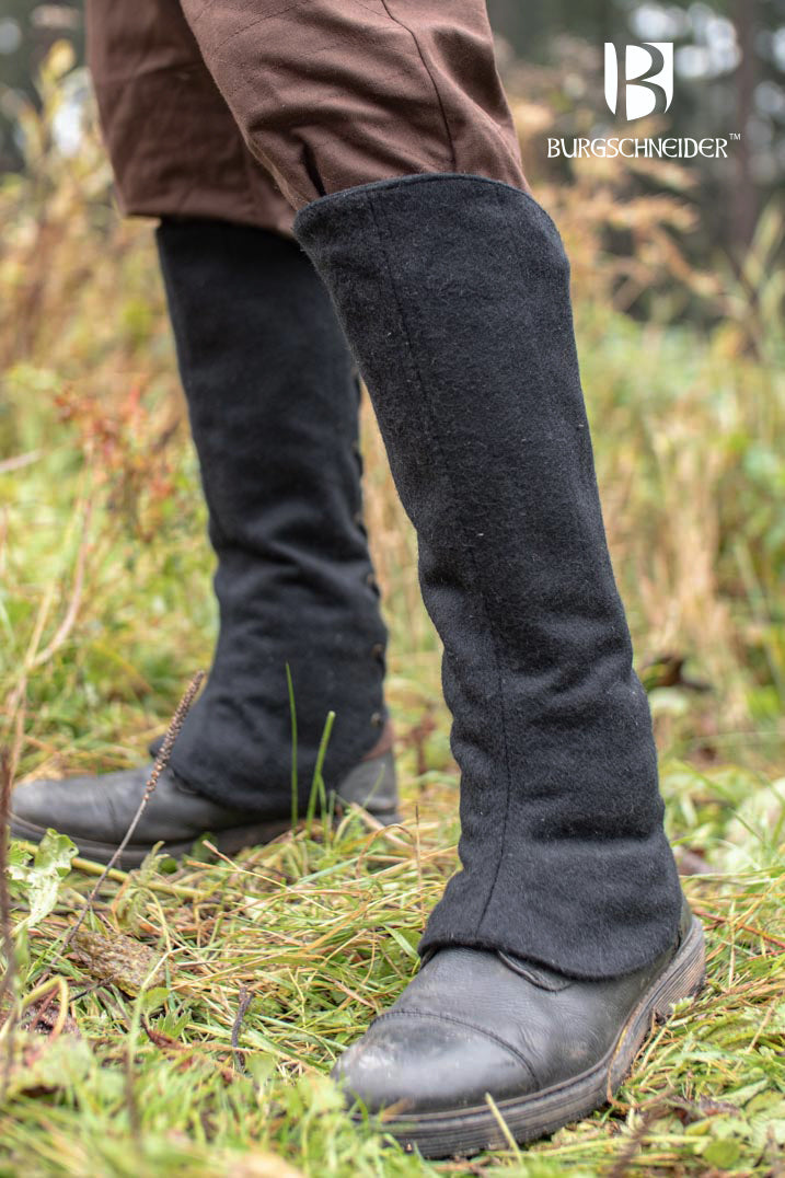 Seran Black Leg Cuffs made from a warm wool blend, featuring back lacing for flexibility, ideal for rogues and hunters.