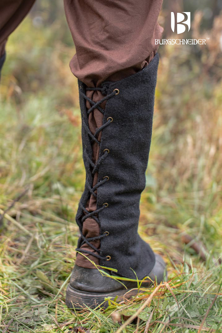 Seran Black Leg Cuffs made from a warm wool blend, featuring back lacing for flexibility, ideal for rogues and hunters.