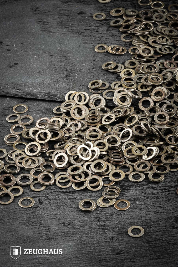 Loose Solid Flat Rings made of mild steel with a natural oiled finish, featuring an inner diameter of 9mm.