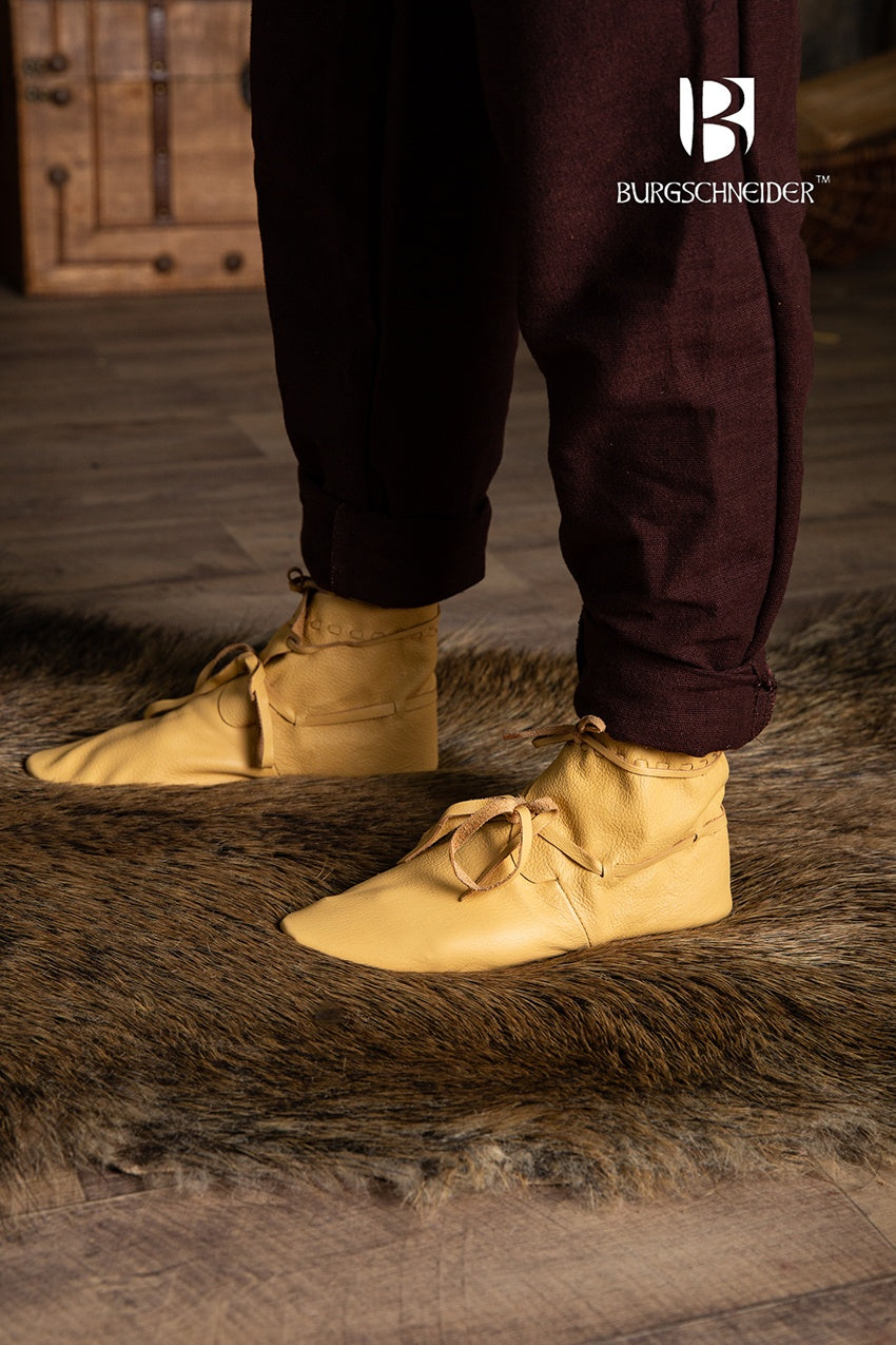 Light brown medieval shoes with lacing, showcasing a classic design suitable for reenactments and fairs.